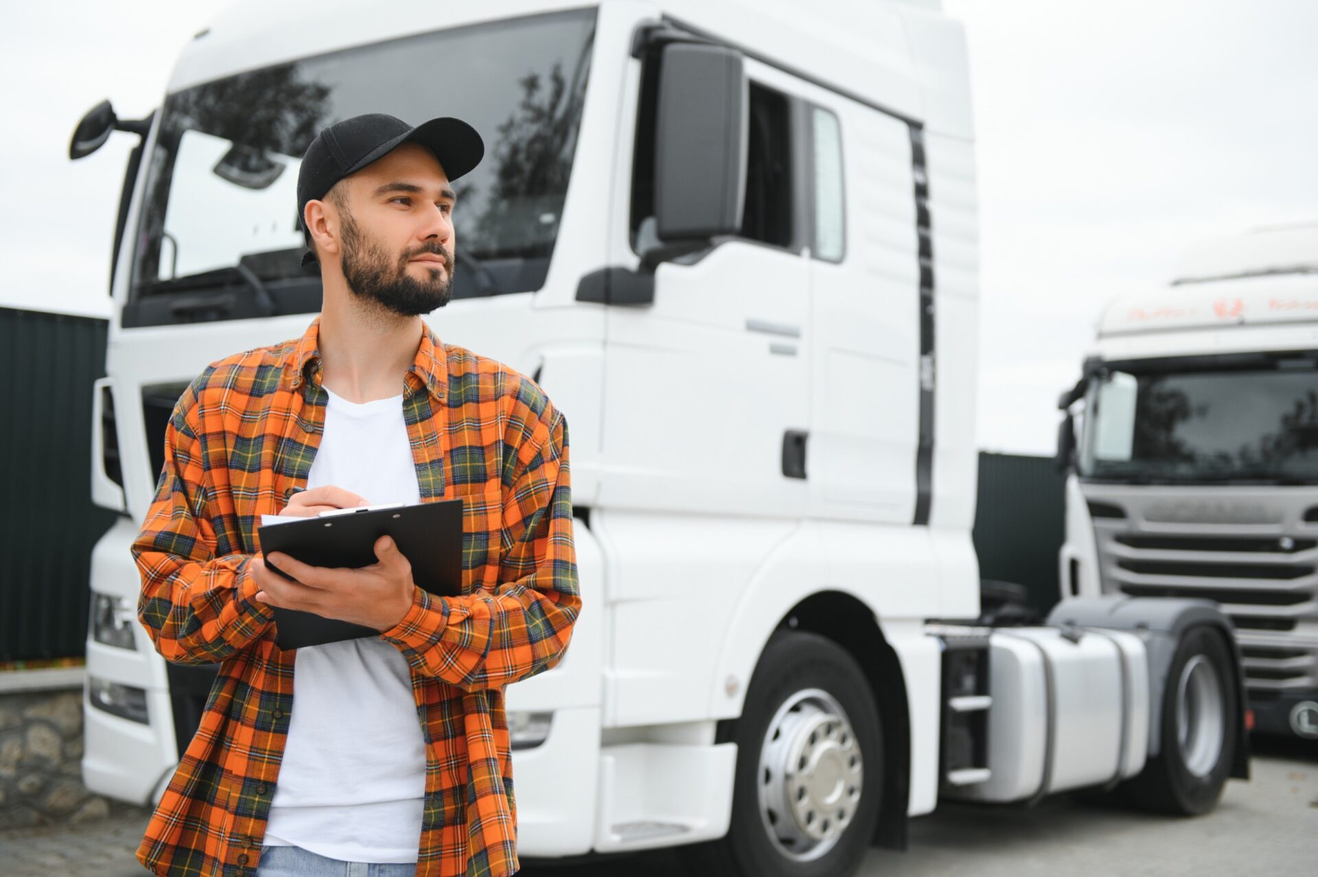 Men driver near lorry truck. Man owner truck driver near truck Men driver near lorry truck. Man owner truck driver near truck